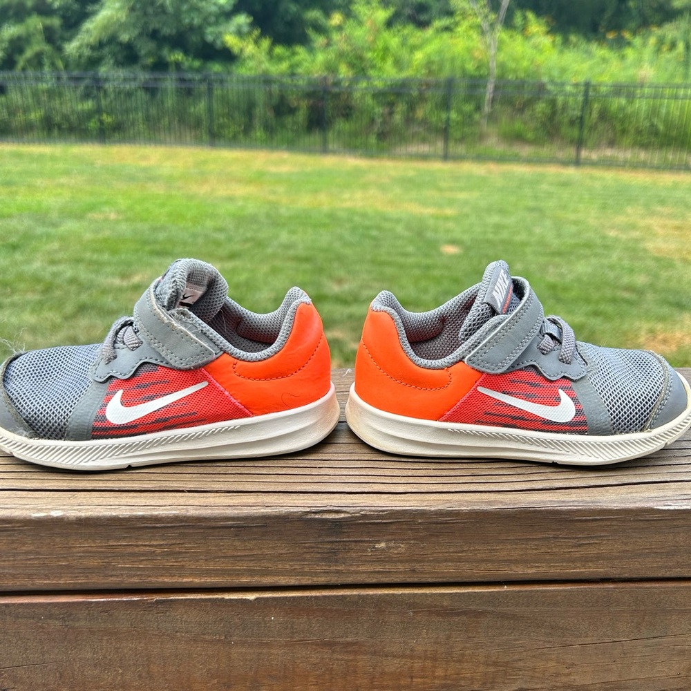 Kids Nikes.  Orange/Gray/white.  Size 8C